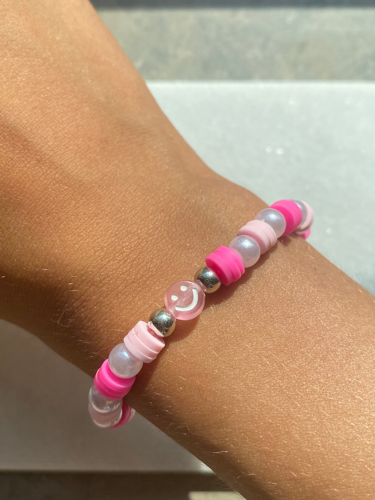 Pink smiley face bracelet